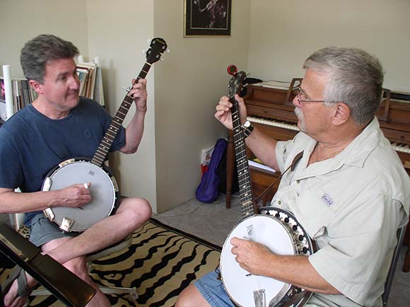 photo of Tim Ward teaching a student the banjo